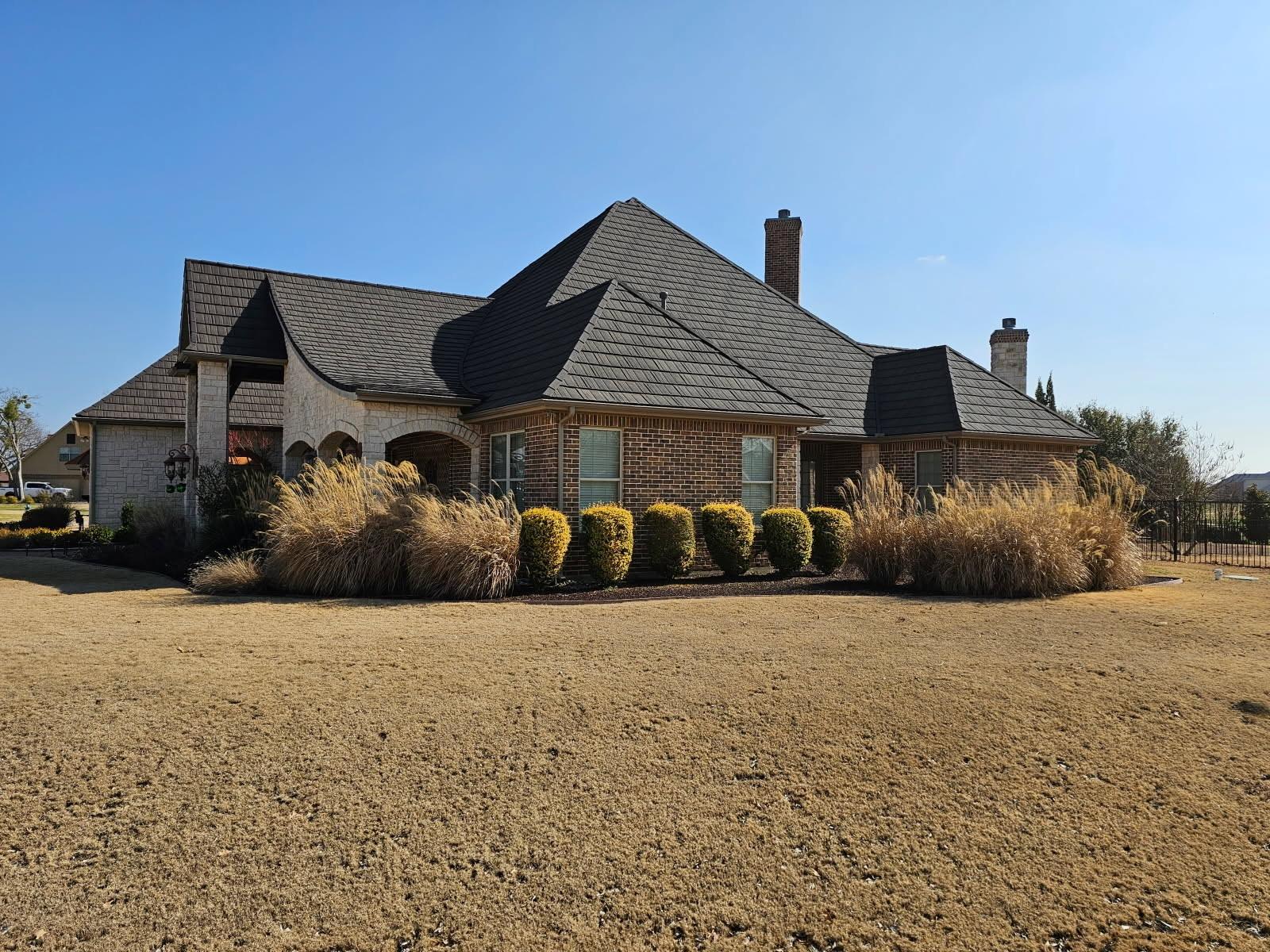 Estate home with a WeatherLok stone-coated steel shake roof